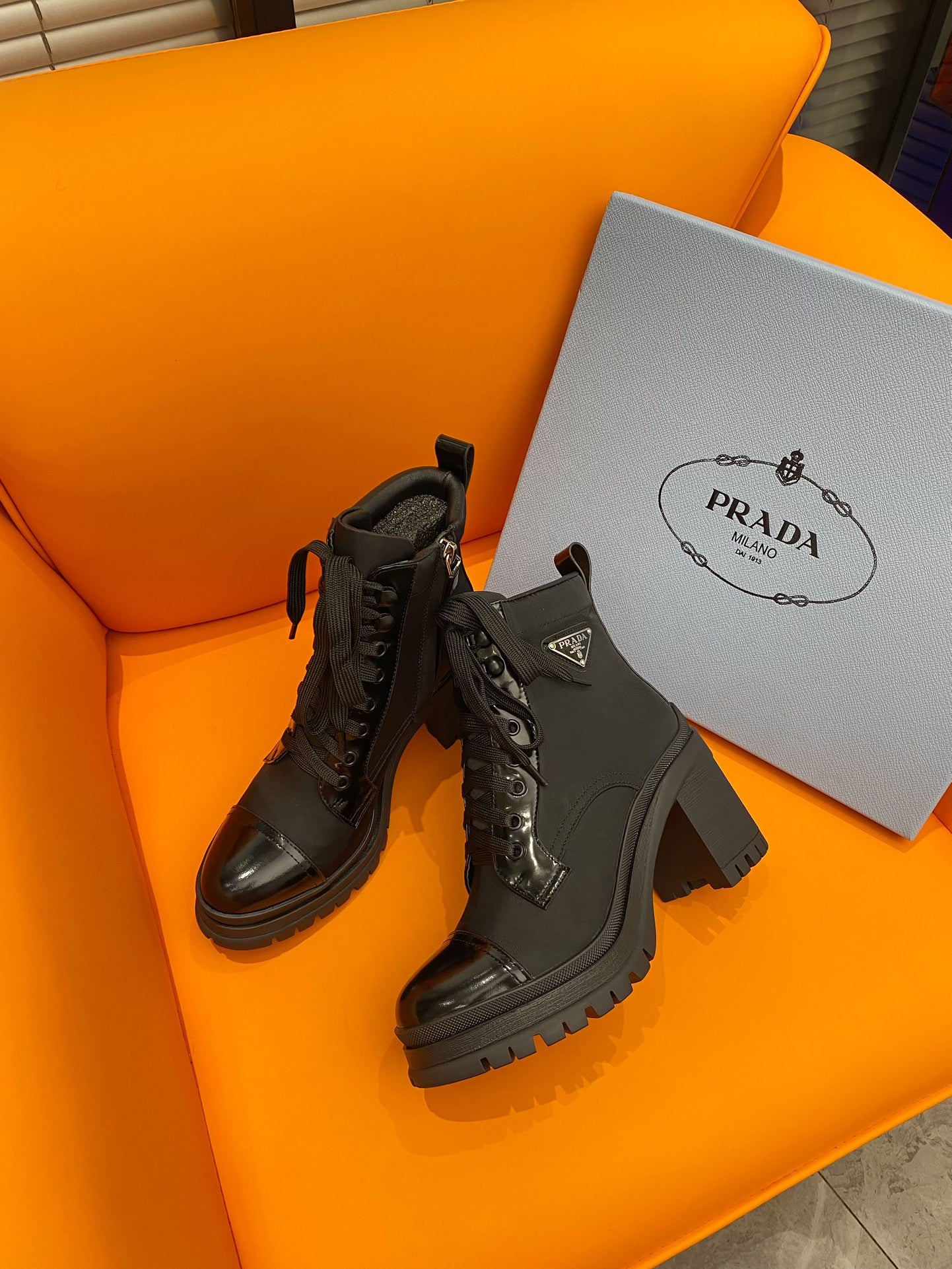 PRADA LOGO PLAQUE ANKLE BOOTS BLACK